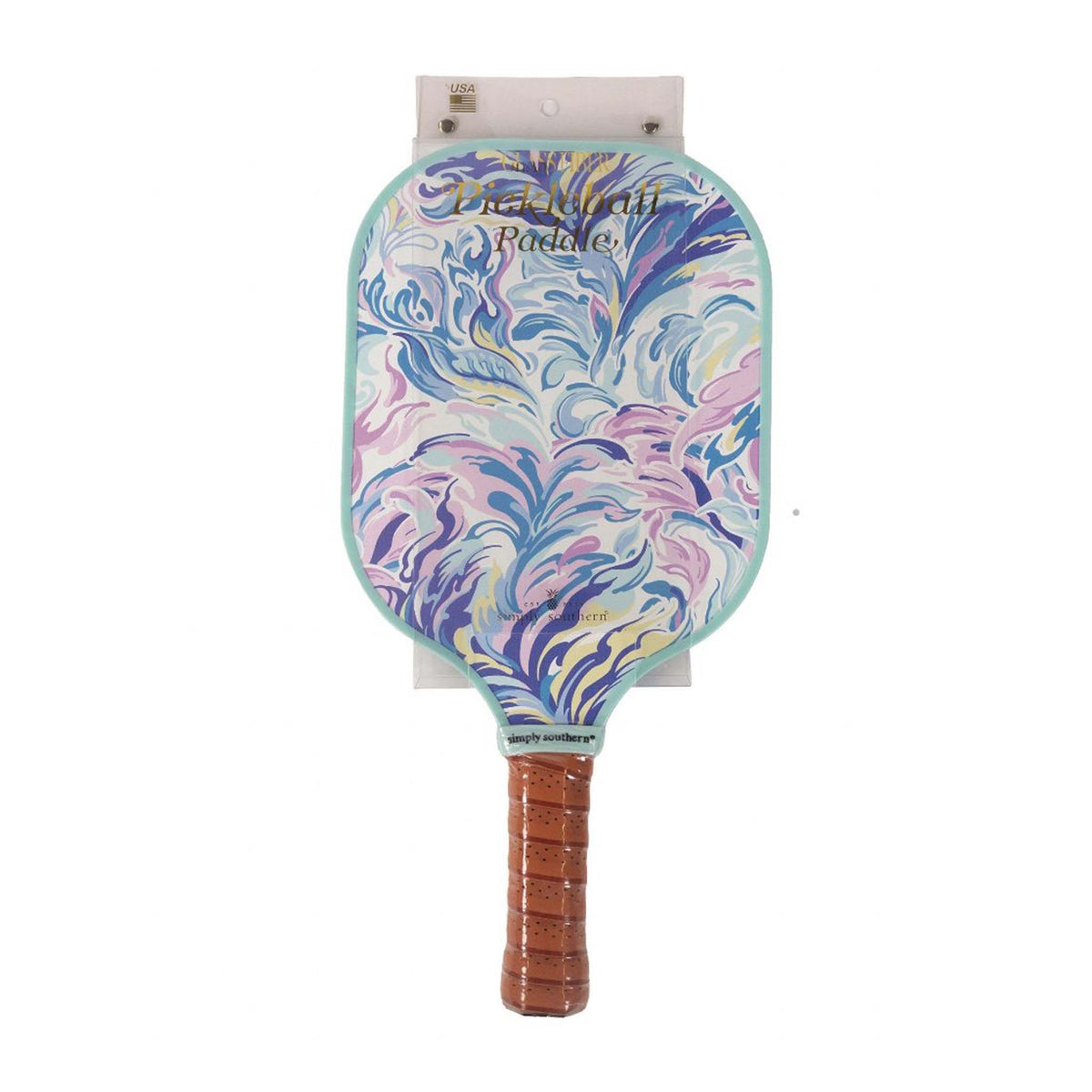 Simply Southern pickleball paddle with a soft watercolor pattern, blending pastel shades of pink, blue, and purple in a fluid, abstract design.