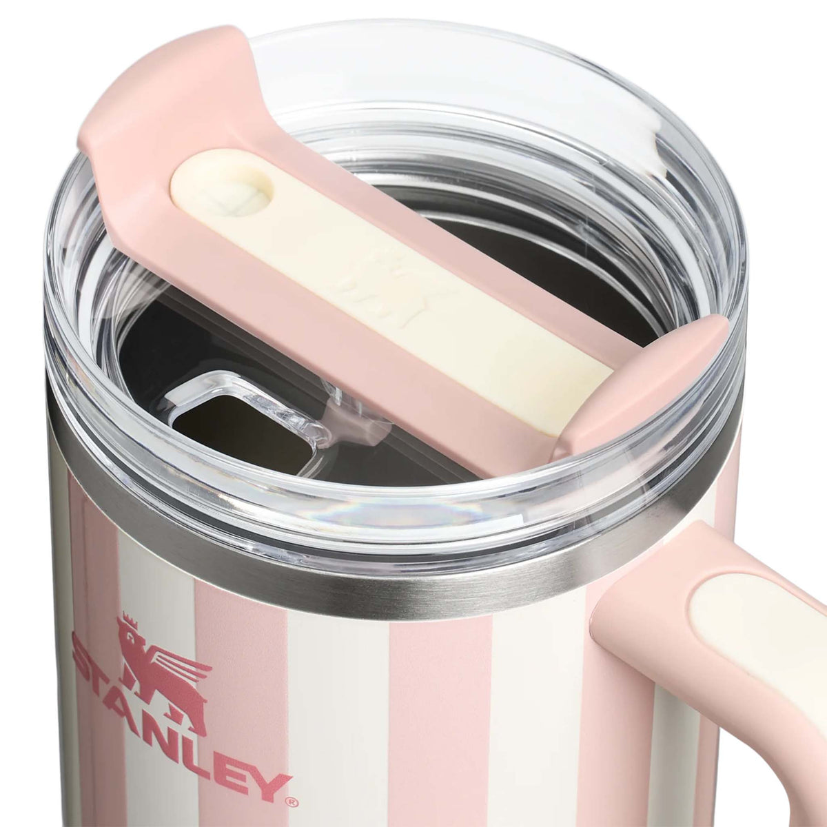 Stanley 40oz handled tumbler in Peach Whip Cabana, a pastel peach-colored stainless steel tumbler with a sturdy ergonomic handle, a clear lid, and a reusable straw.
