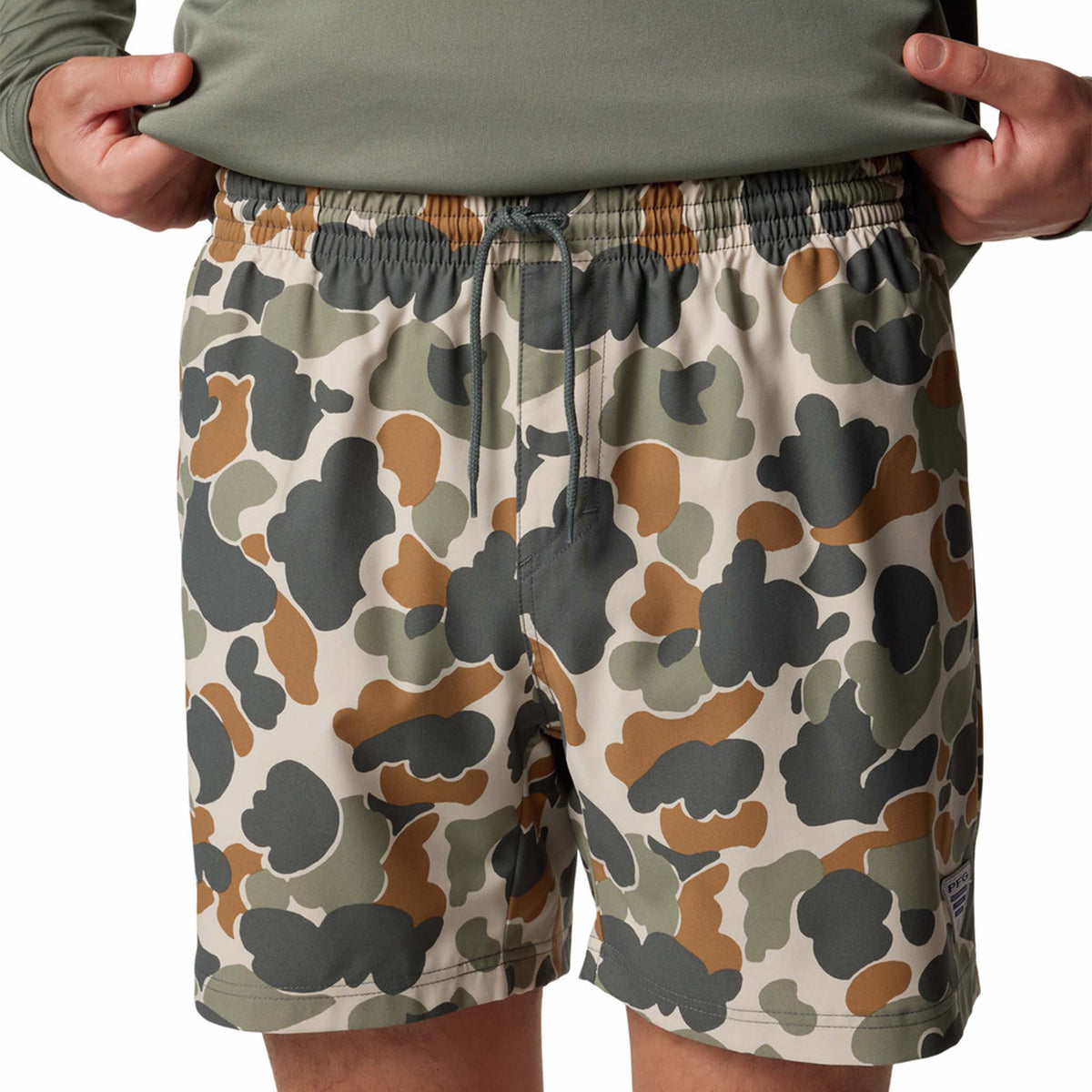 Close Up of Front view - Columbia Sportswear 6&quot; Printed Rambler Men&#39;s swim trunks, color green, tan, brown camo.  Adjustable elastic waistband with drawstring cord to customize fit. Featuring Omni-Shade™ UPF 50 these shorts guard against skin damage. Created for all-day comfort and breathability using fast dry fabric.
