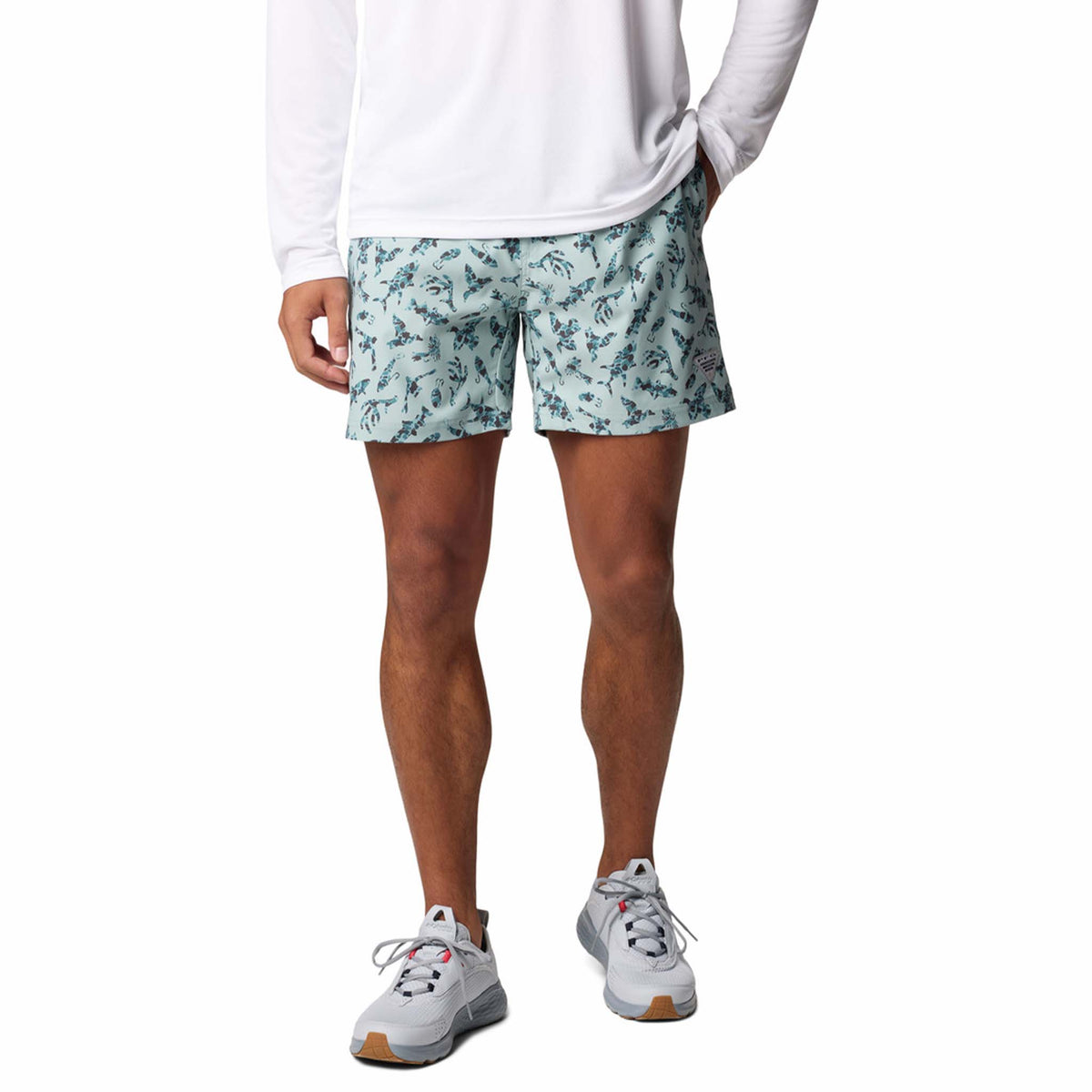 Front view - Columbia Sportswear 6&quot; Printed Rambler Men&#39;s swim trunks, color aqua blue with silhouettes of fishing related icons.  Featuring Omni-Shade™ UPF 50 these shorts guard against skin damage. Created for all-day comfort and breathability using fast dry fabric.