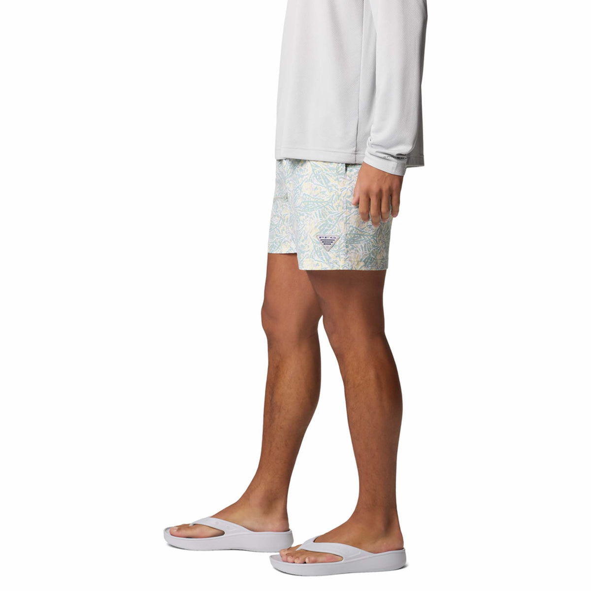 Side view - Columbia Sportswear 6&quot; Printed Rambler Men&#39;s swim trunks, marlin print in colors aqua blue and yellow.  Adjustable elastic waistband with drawstring cord to customize fit. Featuring Omni-Shade™ UPF 50 these shorts guard against skin damage. Created for all-day comfort and breathability using fast dry fabric.