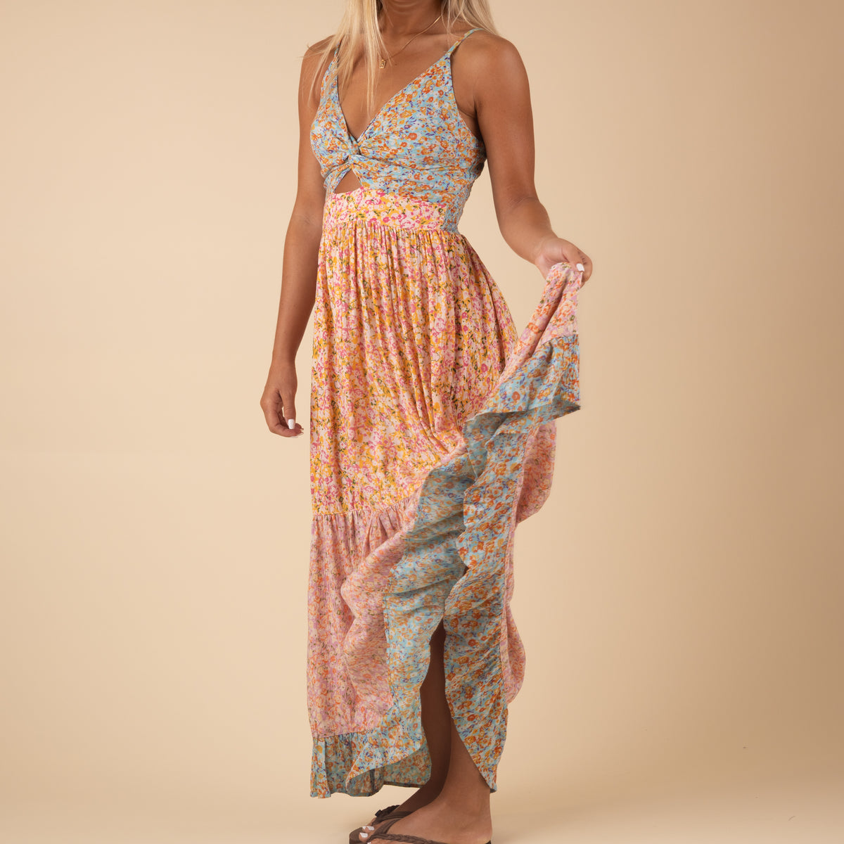 Angie Princess Tiered Maxi Dress, Color multicolored floral prints, sizes S-XL. Women&#39;s floral maxi dress with a princess-style silhouette, featuring multiple tiered layers, a fitted bodice, and flowing skirt; adorned with an all-over floral print, creating a romantic and elegant look suitable for warm weather or special occasions.