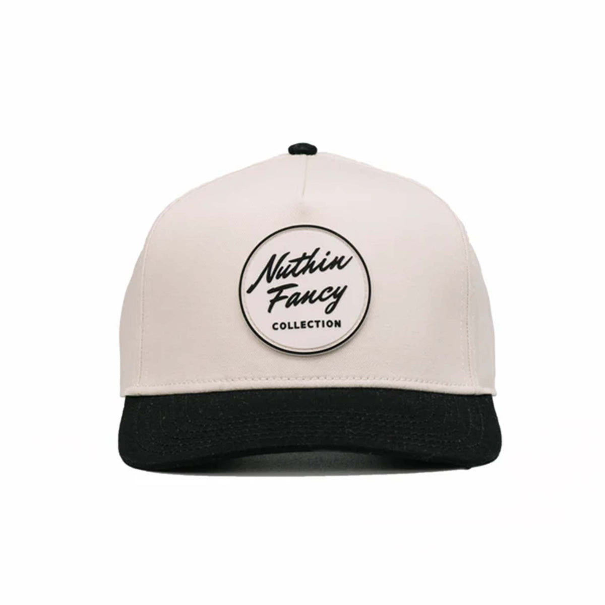 Two-toned 5-panel high crown trucker hat with an off-white front and black pre-curved bill. Features an off-white and black rubber &#39;Nuthin’ Fancy&#39; patch on the front, black mesh back panels, and an adjustable plastic snapback closure. One size fits most.