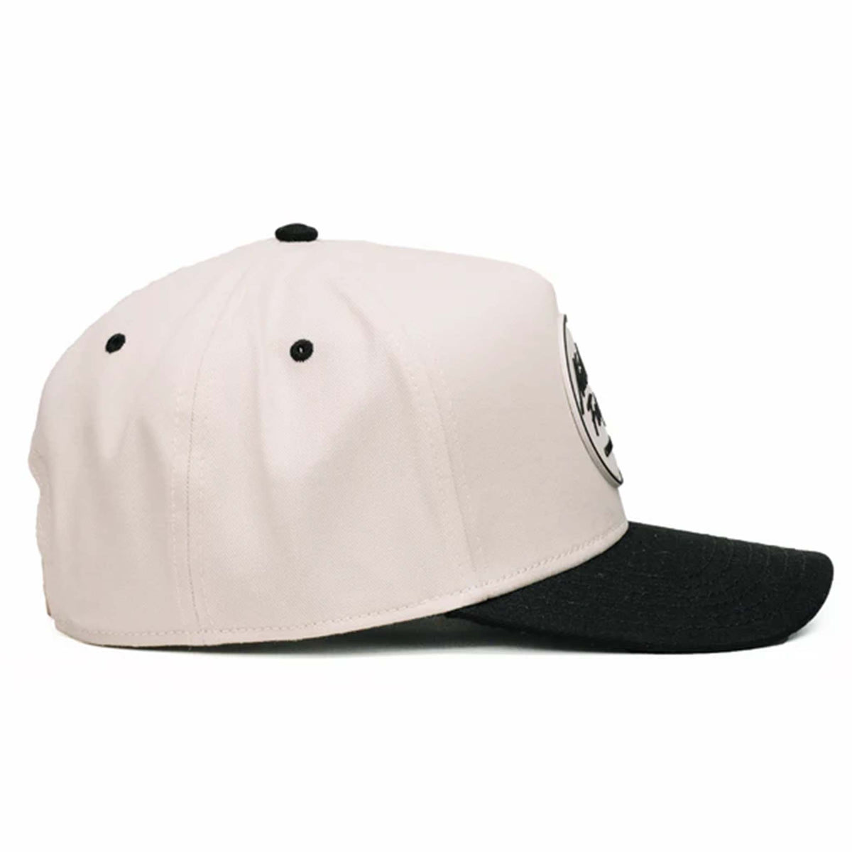 Two-toned 5-panel high crown trucker hat with an off-white front and black pre-curved bill. Features an off-white and black rubber &#39;Nuthin’ Fancy&#39; patch on the front, black mesh back panels, and an adjustable plastic snapback closure. One size fits most.