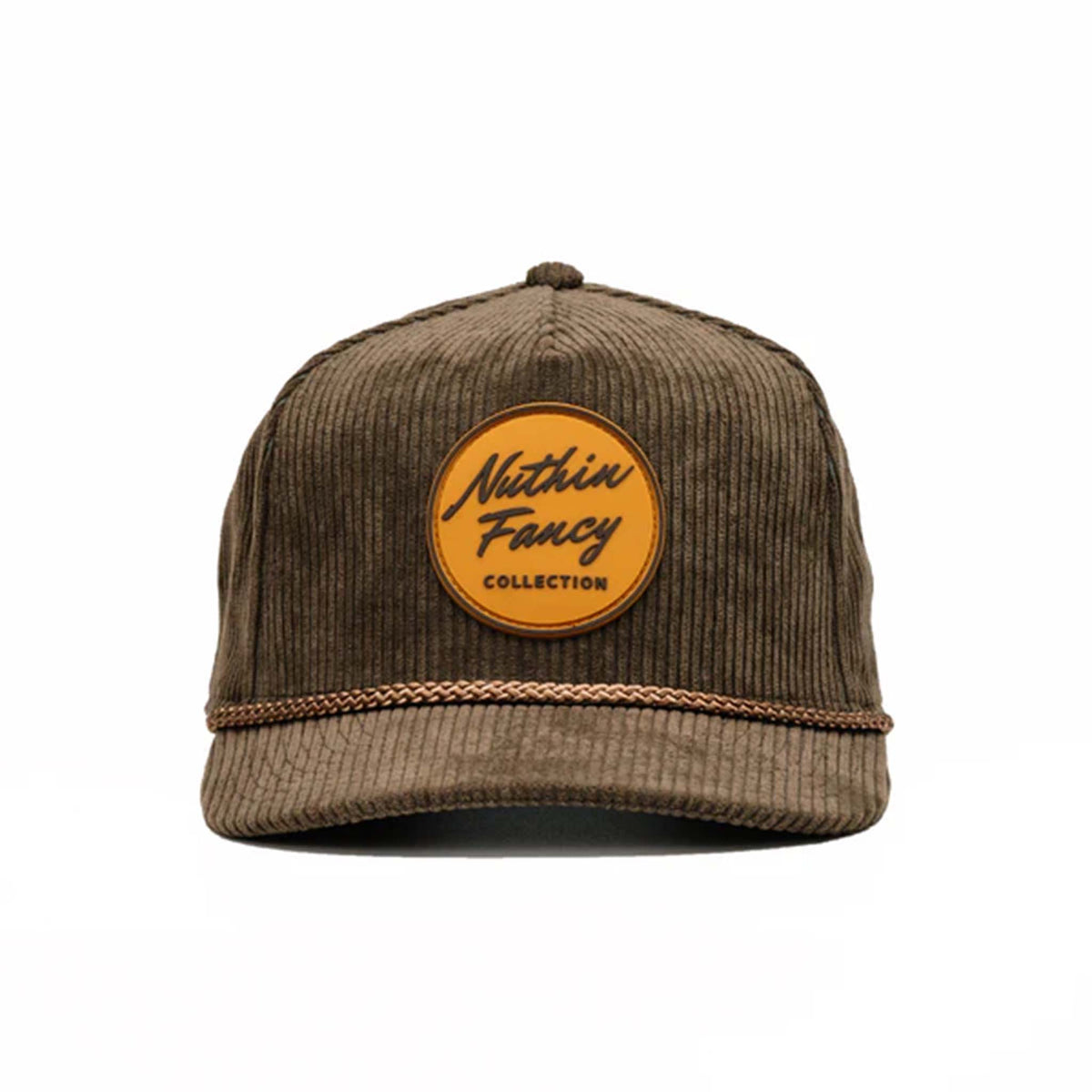 Tan corduroy snapback hat with a slightly curved bill and a brown and tan rubber &#39;Nuthin’ Fancy&#39; logo patch on the front. Features a decorative rope detail above the bill and an adjustable plastic snap closure. One size fits most (58 cm).