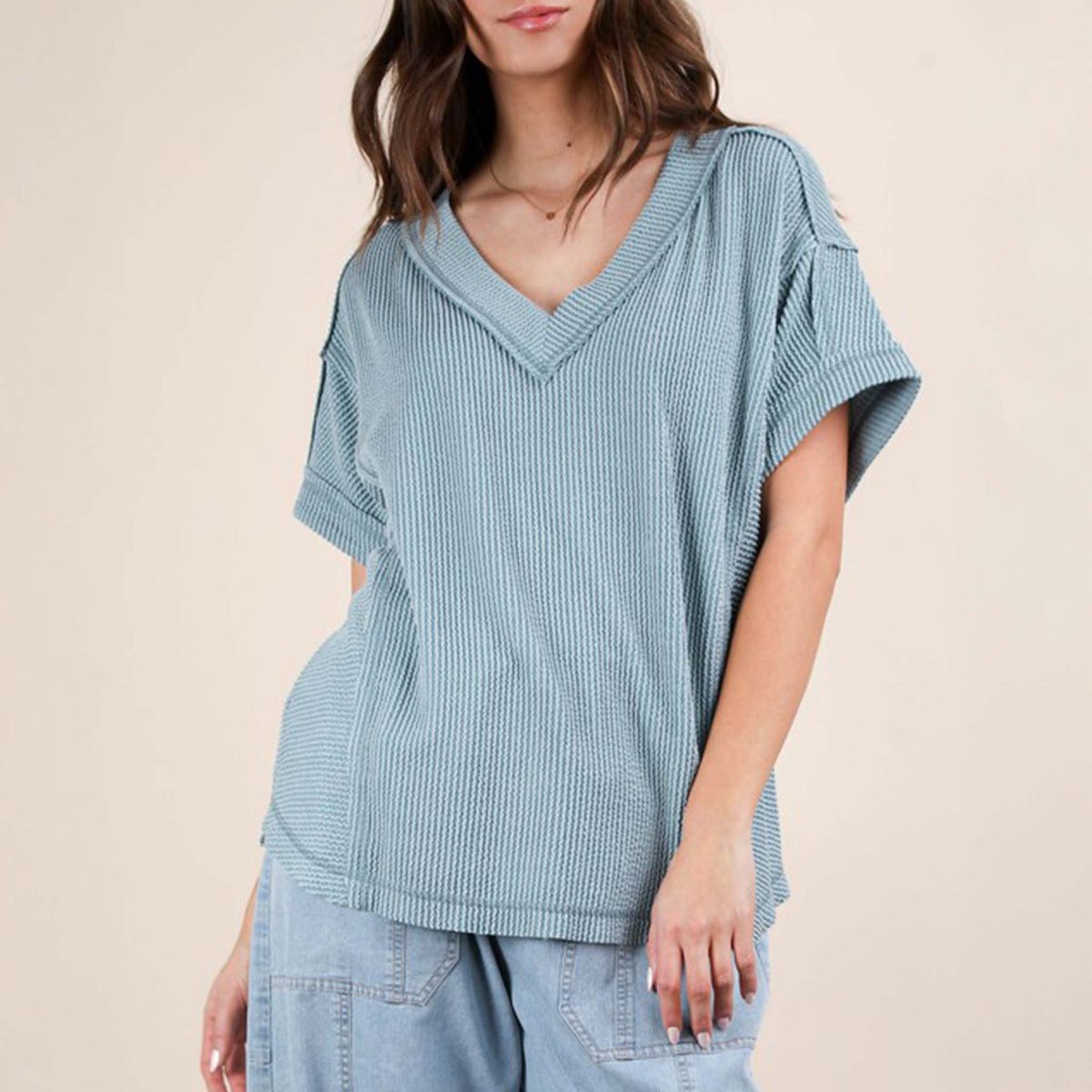 Front view of a woman wearing the Very J Ribbed V-Neck Short Sleeve Knit Top, color Blue, sizes S-L.
A versatile essential, this short-sleeve top features a soft ribbed knit fabric and a flattering V-neckline. Easy to dress up or down, it’s the perfect go-to for effortless everyday style!
Soft Two Tone Casual Comfy Ribbed Knit Top
V-Neck
Short Sleeve
Raw Edge Detail