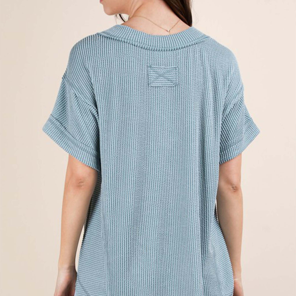 Back view of a woman wearing the Very J Ribbed V-Neck Short Sleeve Knit Top, color Blue, sizes S-L.
A versatile essential, this short-sleeve top features a soft ribbed knit fabric and a flattering V-neckline. Easy to dress up or down, it’s the perfect go-to for effortless everyday style!
Soft Two Tone Casual Comfy Ribbed Knit Top
V-Neck
Short Sleeve
Raw Edge Detail