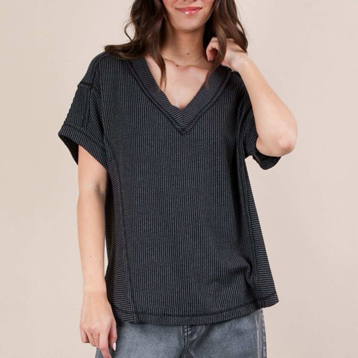 Front view of a woman wearing the Very J Ribbed V-Neck Short Sleeve Knit Top, color Charcoal gray, sizes S-L.
A versatile essential, this short-sleeve top features a soft ribbed knit fabric and a flattering V-neckline. Easy to dress up or down, it’s the perfect go-to for effortless everyday style!
Soft Two Tone Casual Comfy Ribbed Knit Top
V-Neck
Short Sleeve
Raw Edge Detail
