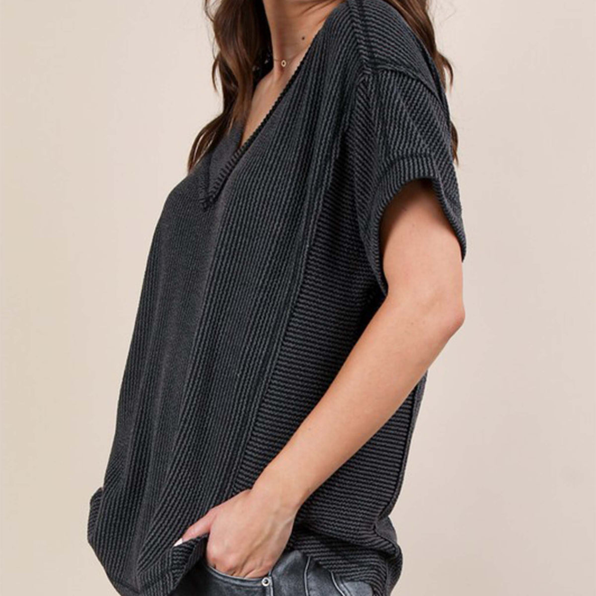 Side view of a woman wearing the Very J Ribbed V-Neck Short Sleeve Knit Top, color Charcoal gray, sizes S-L.
A versatile essential, this short-sleeve top features a soft ribbed knit fabric and a flattering V-neckline. Easy to dress up or down, it’s the perfect go-to for effortless everyday style!
Soft Two Tone Casual Comfy Ribbed Knit Top
V-Neck
Short Sleeve
Raw Edge Detail