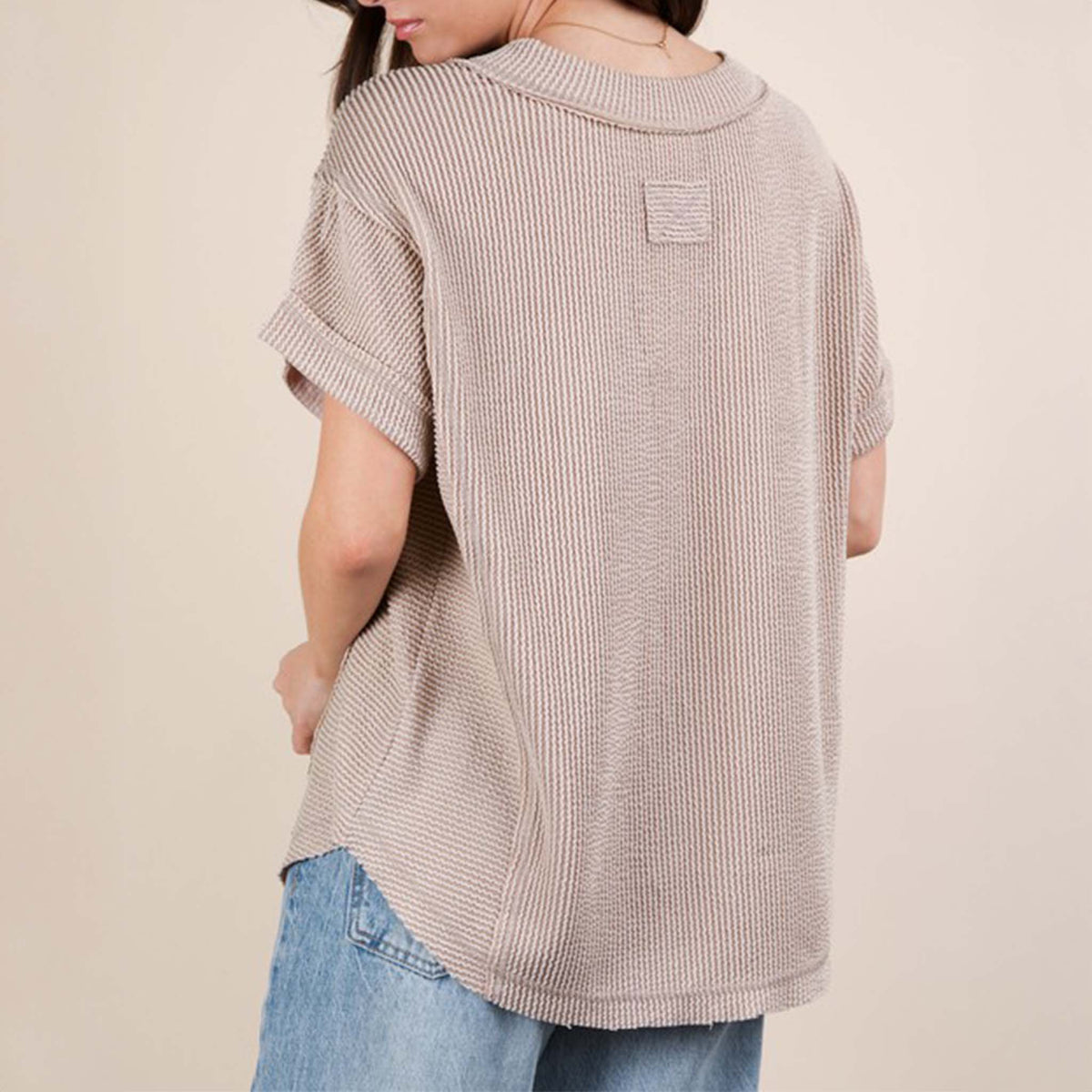 Back view of a woman wearing the Very J Ribbed V-Neck Short Sleeve Knit Top, color Oat, sizes S-L.
A versatile essential, this short-sleeve top features a soft ribbed knit fabric and a flattering V-neckline. Easy to dress up or down, it’s the perfect go-to for effortless everyday style!
Soft Two Tone Casual Comfy Ribbed Knit Top
V-Neck
Short Sleeve
Raw Edge Detail