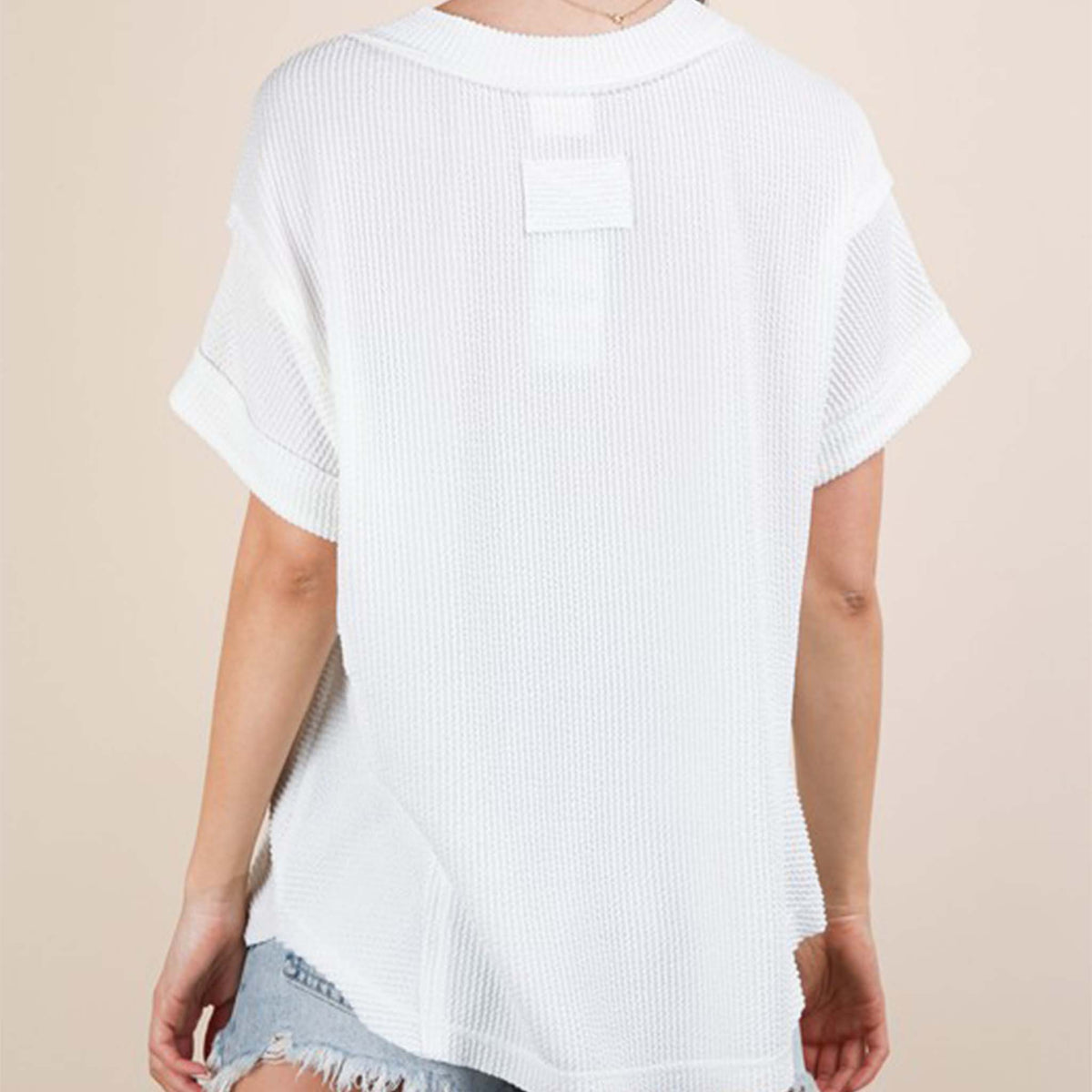 Back view of a woman wearing the Very J Ribbed V-Neck Short Sleeve Knit Top, color White, sizes S-L.
A versatile essential, this short-sleeve top features a soft ribbed knit fabric and a flattering V-neckline. Easy to dress up or down, it’s the perfect go-to for effortless everyday style!
Soft Two Tone Casual Comfy Ribbed Knit Top
V-Neck
Short Sleeve
Raw Edge Detail