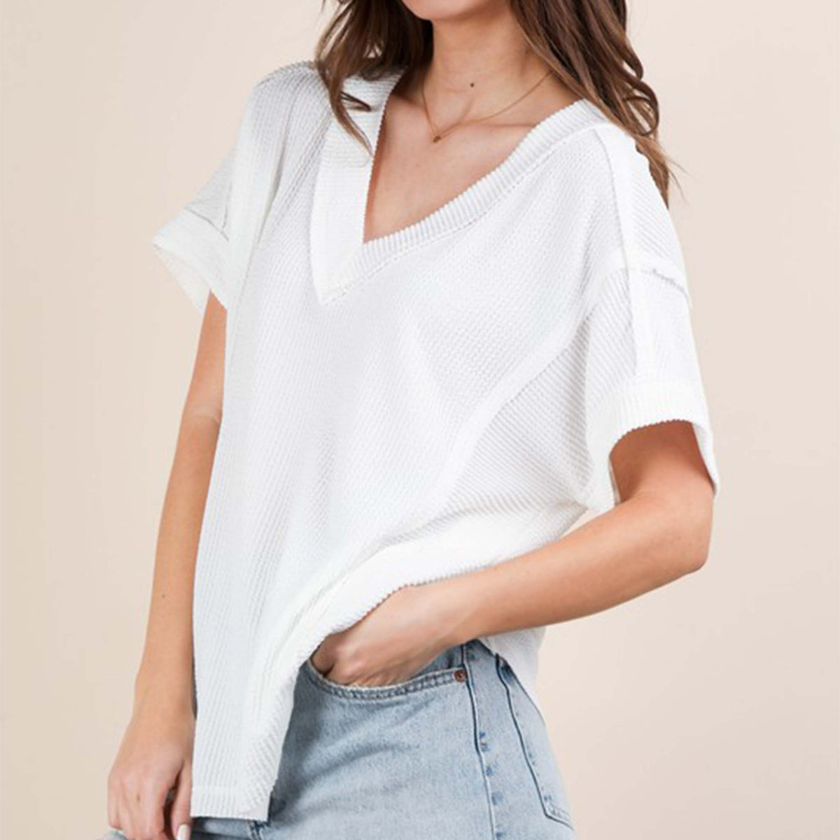 Front view of a woman wearing the Very J Ribbed V-Neck Short Sleeve Knit Top, color White, sizes S-L.
A versatile essential, this short-sleeve top features a soft ribbed knit fabric and a flattering V-neckline. Easy to dress up or down, it’s the perfect go-to for effortless everyday style!
Soft Two Tone Casual Comfy Ribbed Knit Top
V-Neck
Short Sleeve
Raw Edge Detail