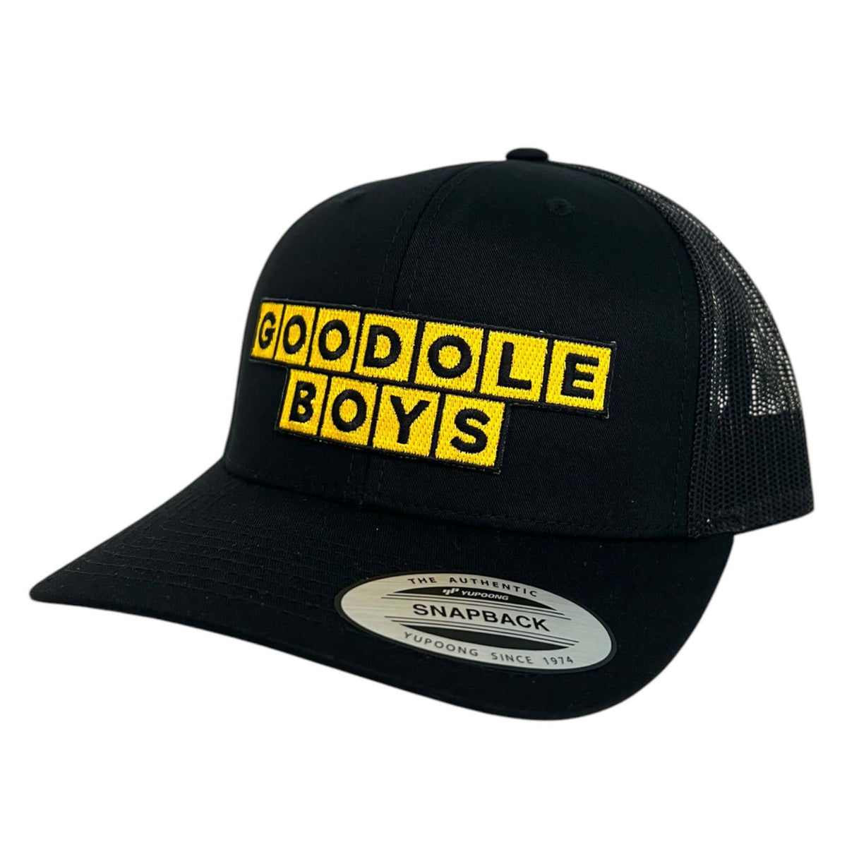 Good Ole Boys Adjustable Trucker Hat, color black.  This hat features bright yellow blocks with Good Ole Boys embroidered in each block in black thread.  Adjustable snapback closure, soft mesh backing, mid-profile, pre-curved PE visor.