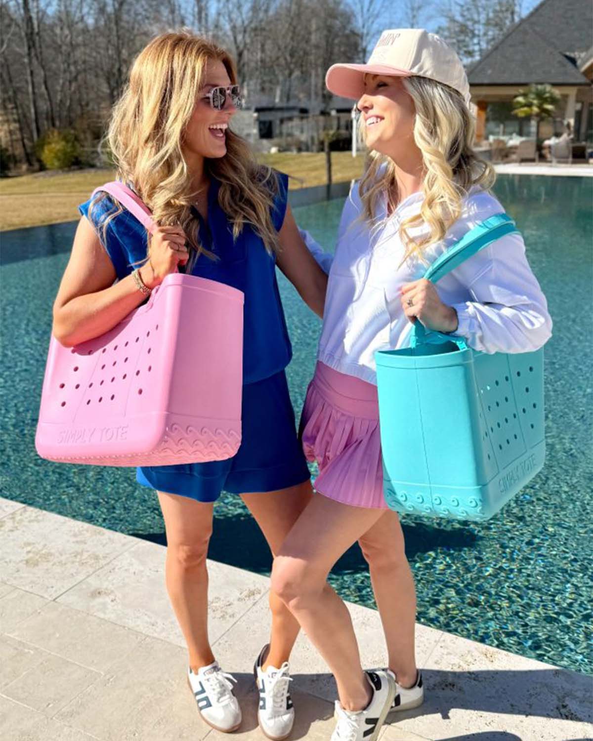 women standing by a pool with simply southern totes