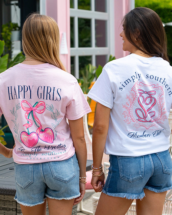 two girls wearing simply southern t-shirts posing for a picture