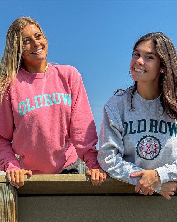 two girls wearing old row sweatshirts